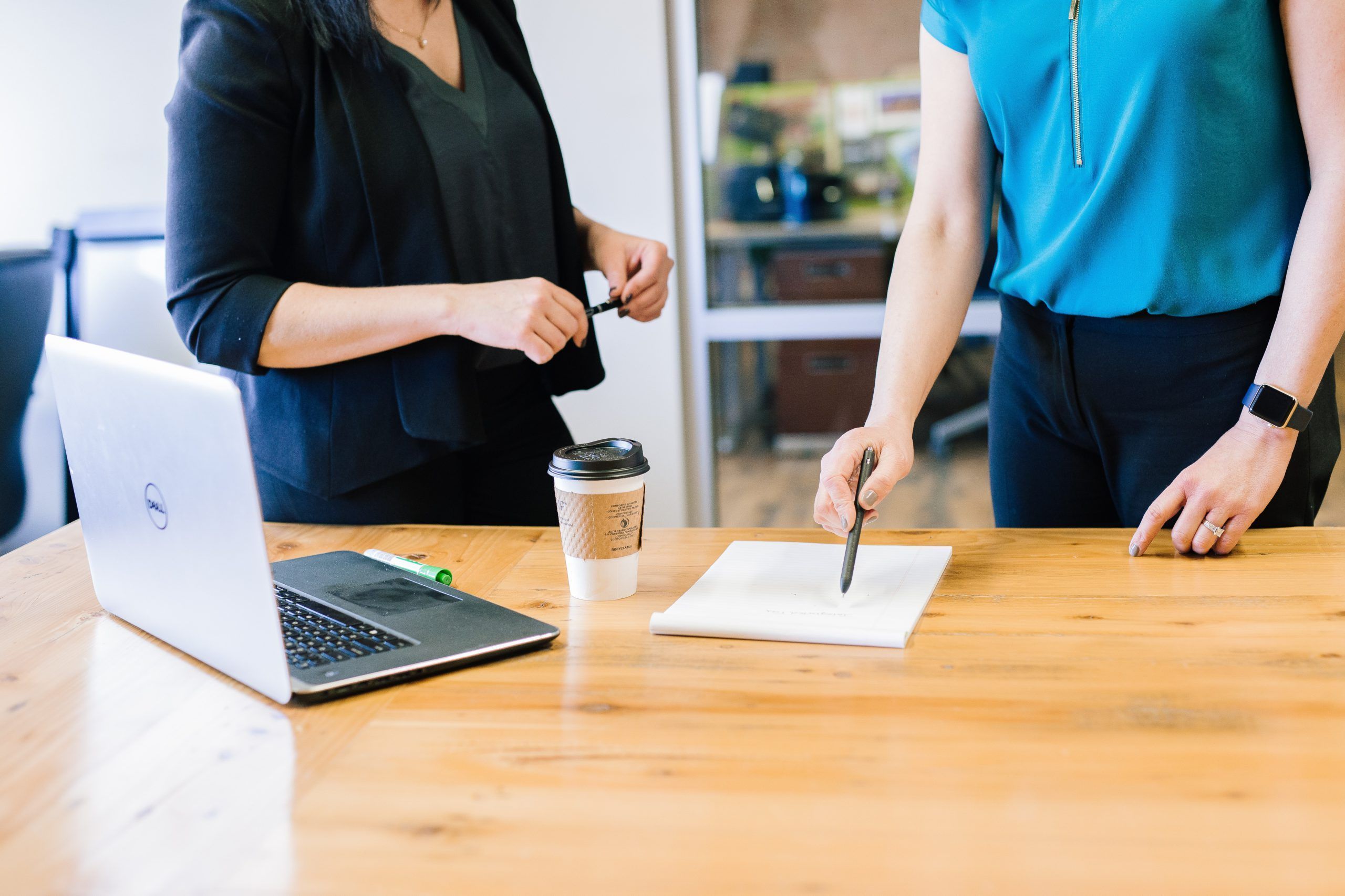 Two women managing language service projects